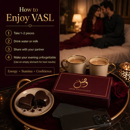 A promotional scene for VASL shows a dark tray with a burgundy chocolate box labeled 'DAKE CHOCOLATE,' two cream mugs with gold trim, and heart-shaped chocolates on a gold tray. A phone lies in front, and a blurred couple shares a romantic moment on a bed in the background.