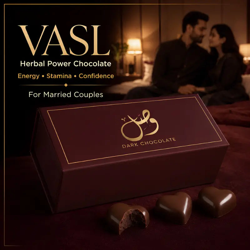 A dark chocolate gift box with gold lettering sits on a dark red surface, with three chocolate pieces in front and a softly blurred couple in a bedroom in the background. Text on the left reads 'VASL Herbal Power Chocolate' and 'For Married Couples'.
