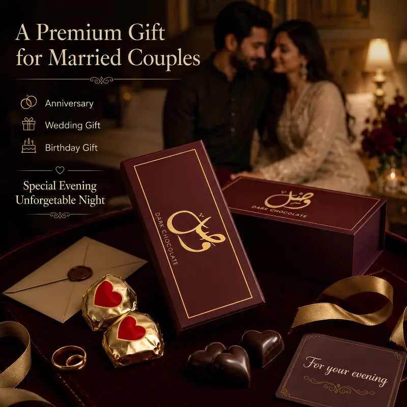 A premium chocolate gift set for married couples, featuring dark chocolate boxes with gold foil lettering, wrapped chocolates with red hearts, gold rings, and a card, set against a romantic dinner scene with a couple in the background.